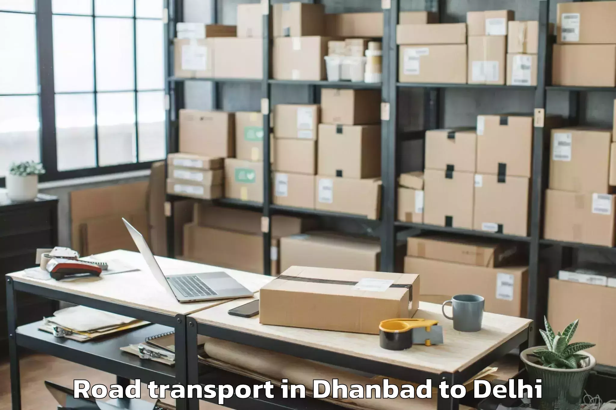 Get Dhanbad to Unity One Mall Rohini Road Transport